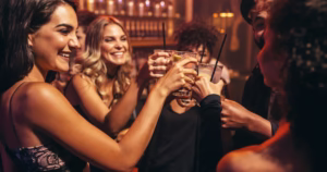 People drinking at music venue