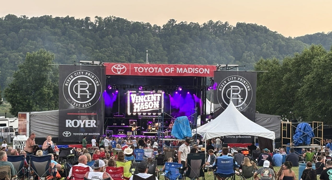 Stage with large-area scrim/fabric panels attached.